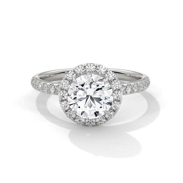 A brilliant round lab-grown diamond encircled by a halo of sparkle — timeless beauty with radiant allure.