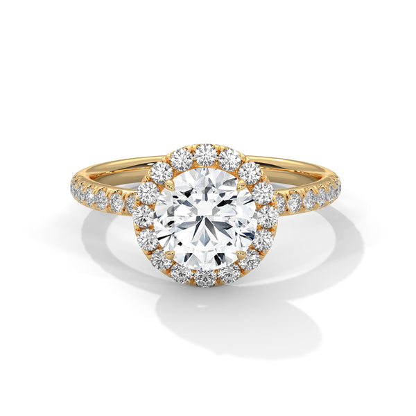 A brilliant round lab-grown diamond encircled by a halo of sparkle — timeless beauty with radiant allure.