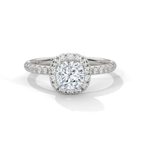 A cushion-cut lab-grown diamond surrounded by a delicate halo — timeless romance with a soft, feminine glow