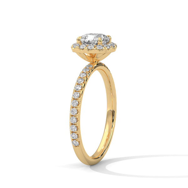 A cushion-cut lab-grown diamond surrounded by a delicate halo — timeless romance with a soft, feminine glow