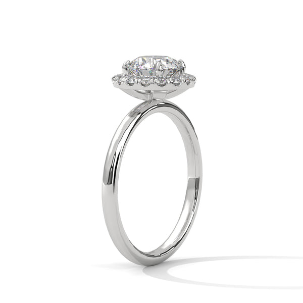A classic round lab-grown diamond framed by a radiant halo — timeless brilliance with modern grace
