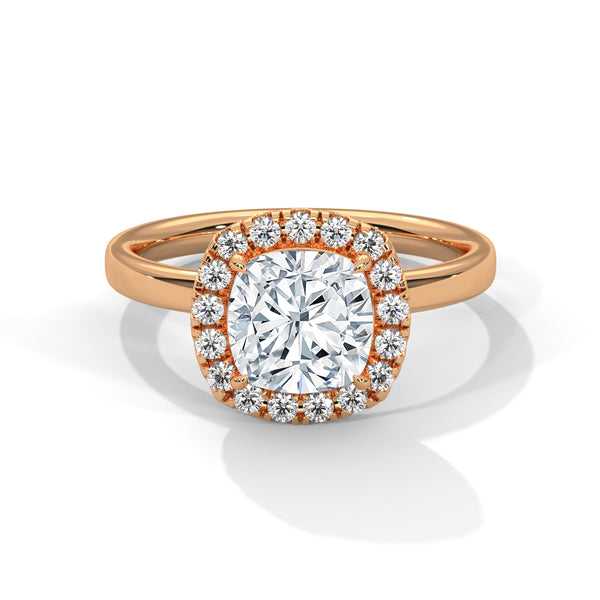 A soft cushion-shaped halo embraces a brilliant round lab-grown diamond — a romantic take on radiant sparkle.