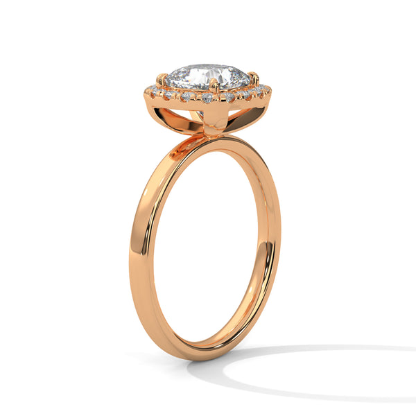 A soft cushion-shaped halo embraces a brilliant round lab-grown diamond — a romantic take on radiant sparkle.