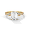 The Celestial Elegance Ring features a striking emerald-cut diamond embraced by a delicate band adorned with shimmering pave stones. A timeless piece that symbolizes everlasting love and sophistication.