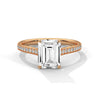 The Celestial Elegance Ring features a striking emerald-cut diamond embraced by a delicate band adorned with shimmering pave stones. A timeless piece that symbolizes everlasting love and sophistication.