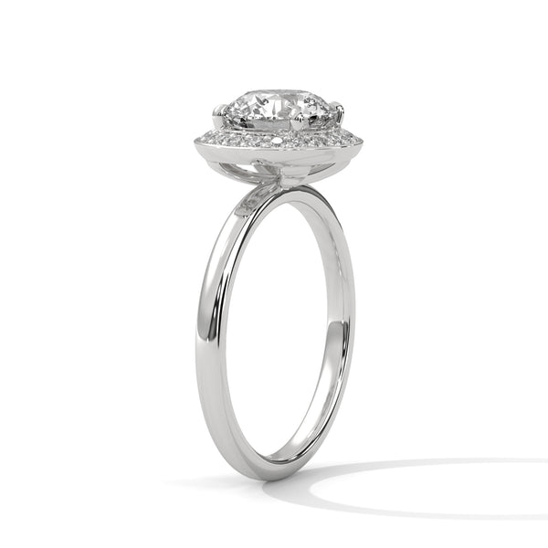 “Celestial Halo Ring—round-cut brilliance, radiant halo sparkle, and white-gold elegance crafted to symbolize everlasting love, timeless beauty, and unforgettable engagements.”