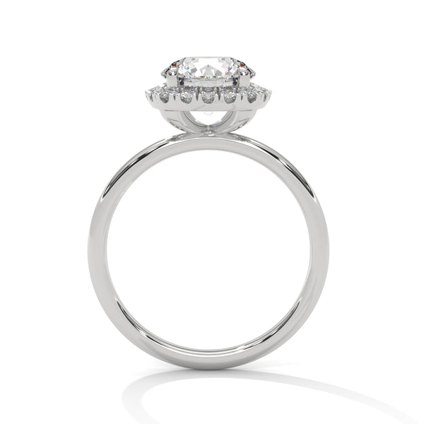 “Aurielle Ring—round-diamond brilliance, cushion-halo elegance, and sleek white-gold luxury crafted to symbolize timeless love, modern charm, and unforgettable moments.”