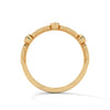 A whimsical yellow gold band featuring alternating bezel and pavé-set diamonds, creating a playful, elegant sparkle.