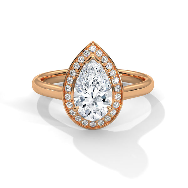 “Celeste Ring—pear-shaped diamond brilliance, radiant halo sparkle, and modern white-gold elegance crafted to symbolize celestial beauty, timeless love, and unforgettable moments.”