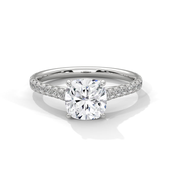 “Lumière Ring—cushion-cut diamond brilliance, pavé-band sparkle, and refined white-gold elegance crafted to symbolize timeless beauty, radiant love, and unforgettable moments.”