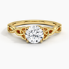 A round brilliant solitaire embraced by an intricate vine-inspired setting, intertwining elegance and organic artistry.