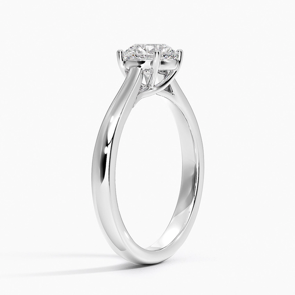 Astrielle Grace radiates refined simplicity with its elegant cathedral setting and softly tapered band, offering a timeless frame for its center diamond.