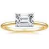 Solstice Grace is a minimalist masterpiece, showcasing an emerald-cut diamond in a classic four-prong setting with a smooth, polished band that radiates refined simplicity.