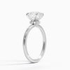A round brilliant solitaire embraced by an intricate vine-inspired setting, intertwining elegance and organic artistry.