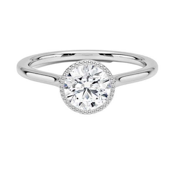 Liora Crest captures the essence of modern grace, featuring a sculptural split-shank design and a bezel-style crown accented with fine milgrain.