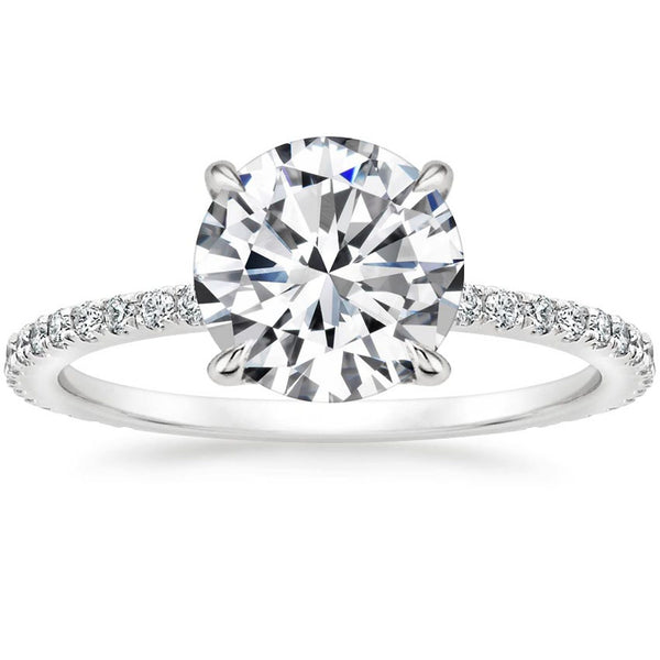 “Elevate your love with this dazzling round-cut diamond ring, featuring a sparkling pavé band crafted for timeless elegance and unforgettable brilliance.”