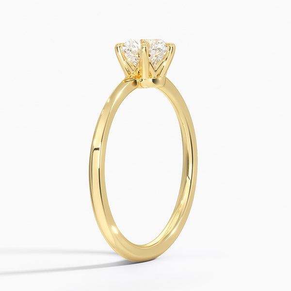 Solenya Whisper is a sleek, minimalist solitaire ring that blends subtle elegance with enduring craftsmanship, letting its brilliant center diamond speak volumes.