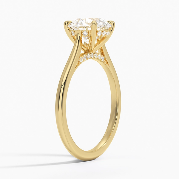 A sweeping cathedral-style solitaire ring with hidden diamond accents and a round brilliant center, blending elegance and modern refinement.