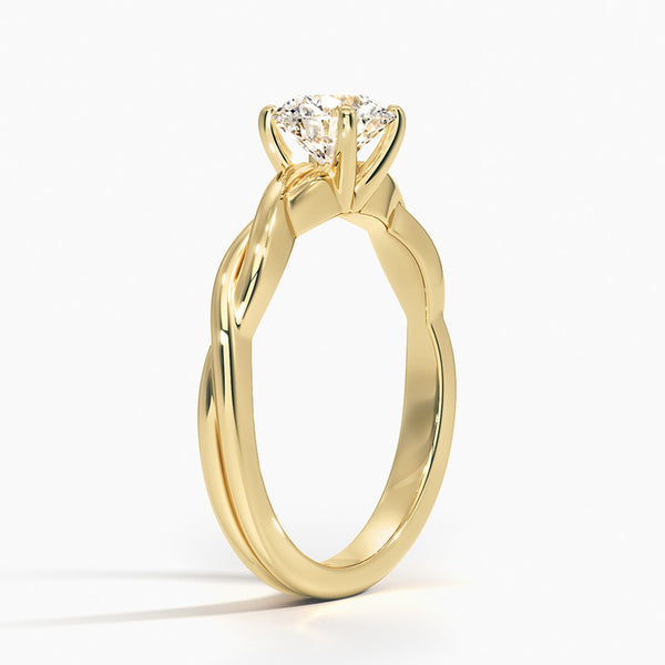 A bold expression of timeless beauty, the Solara Crest features a radiant round diamond set atop a luminous yellow gold band—classic, confident, and endlessly elegant.