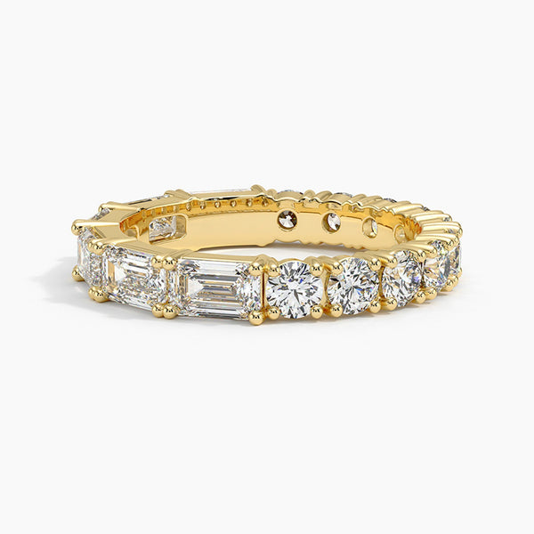 “Radiate elegance with this luxurious mixed-shape diamond eternity ring, crafted in gleaming yellow gold for timeless sparkle, brilliance, and unmatched style.”