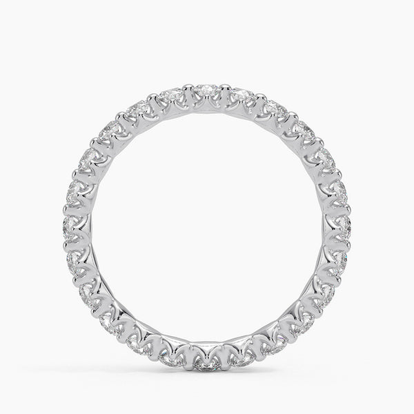 “Elegant diamond eternity ring crafted in shimmering white metal, showcasing brilliant round stones for timeless sparkle, luxury style, and lasting sophistication.”