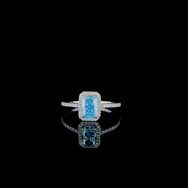 Engagement Ring in a Halo Pavé style featuring a radiant-cut blue diamond centerpiece. (1.35 ct. tw.) 14kt White Gold