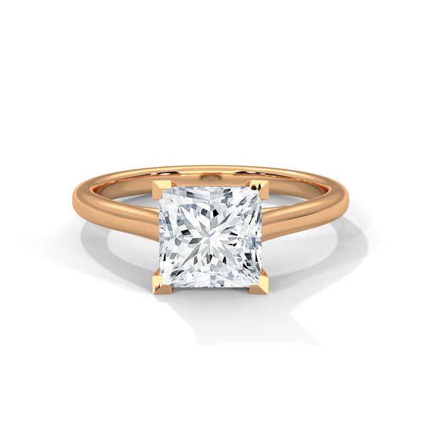 “Luna Ring—princess-cut diamond brilliance, minimalist four-prong elegance, and timeless solitaire beauty crafted to symbolize pure love, modern simplicity, and lasting sophistication.”