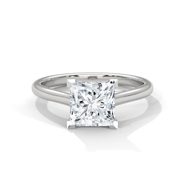 “Luna Ring—princess-cut diamond brilliance, minimalist four-prong elegance, and timeless solitaire beauty crafted to symbolize pure love, modern simplicity, and lasting sophistication.”