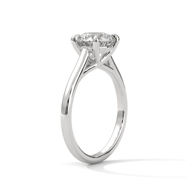 “Aurora Ring—round brilliant diamond sparkle, classic six-prong elegance, and timeless solitaire beauty crafted to symbolize enduring love, refined style, and radiant grace.”